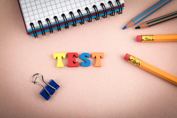 Test. Wooden letters on the office desk, informative and communication background