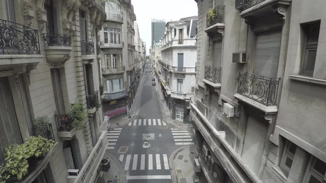AERIAL: Empty no people narrow street in old center quarantine isolated Buenos Aires / apocalyptic view at sunny day