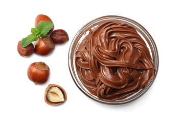 chocolate cream with hazelnut isolated on white background. cream in glass bowl. top view