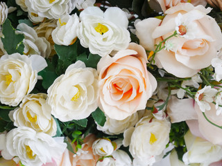 Rose fake flower and Floral background. rose flowers made of fabric. The fabric flowers bouquet. Colorful of decoration artificial flower