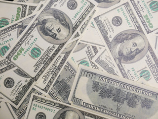 One hundred dollars pile, many dollars money background