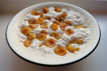 Dough for pancakes with dried apricots
