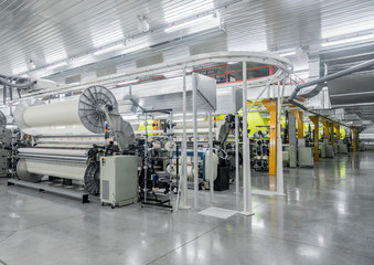 Machine and equipment in the weaving shop, a general overview. interior of industrial textile factory