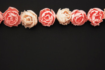 Pink Fake Rosess Black Background. Lot of Artificial Pink Peach Flowers in Raw Copy space