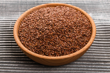 flaxseed and oil on a rustic background