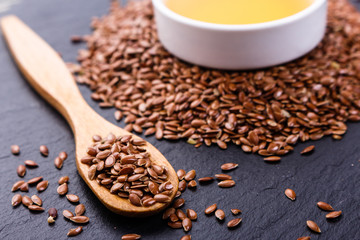 flaxseed and oil on a rustic background