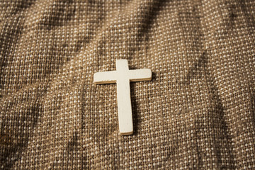 cross on sackcloth background