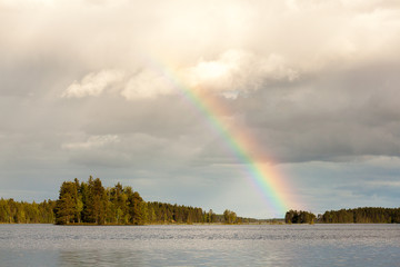 Rainbow and clouds over the lake