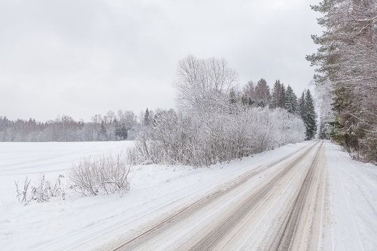 Winter road and cloudy sky
