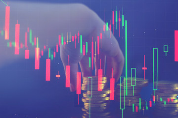 Business graph charts of financial instruments with various type of indicators combine with gold and account book and money and