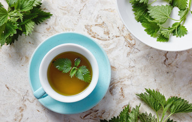 Nettle tea and fresh nettle leaves