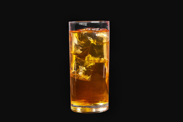 A single-colored transparent cocktail, refreshing in a tall glass with ice cubes with the taste of pear, melon, apple, apricot, peach. Side view Isolated black background. Drink for the menu