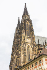 Fototapeta na wymiar Tower of the Metropolitan Cathedral of Saints Vitus, Wenceslaus and Adalbert is a Roman Catholic metropolitan cathedral in Prague