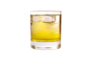 A single-colored transparent cocktail, refreshing in a low glass with radiant ice cubes, carbonated with a taste of melon, pineapple, pear, apple, fruit. Side view Isolated white background