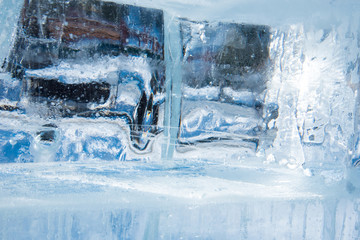 Naklejka na ściany i meble Beautiful blue texture of transparent winter ice with rainbow colors