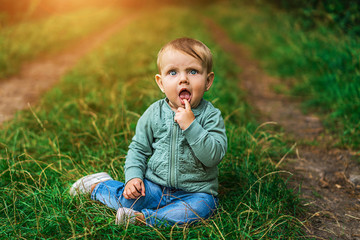 Fototapeta premium Pretty little baby girl playing outdoor