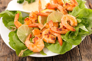 grilled shrimp, skewer and salad