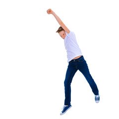 A little boy of school age jumps.