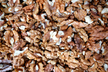 Closeup of big shelled walnuts pile. Top view