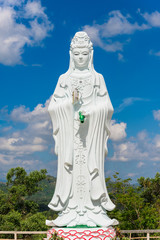 Big Statue of Guanyin on blue sky at Wat Suwan Khiri, Simmulate of Golden Shwedagon Pagoda , Ranong, Thailand