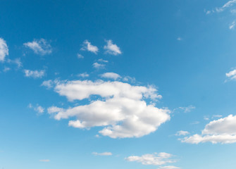 Naklejka na ściany i meble beautiful fluffy clouds against a blue sky