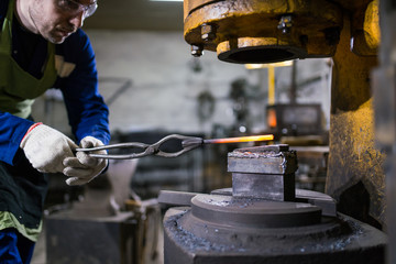 brutal man forges iron