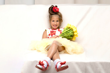 Little girl with a bouquet of flowers