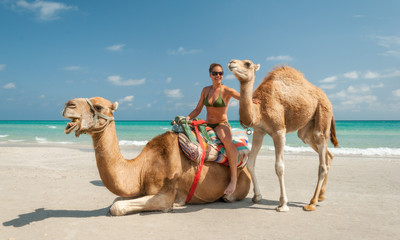 Pretty Young Woman Sitting on a Camel