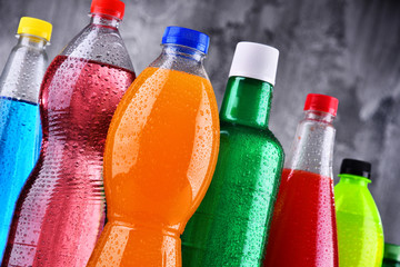 Plastic bottles of assorted carbonated soft drinks