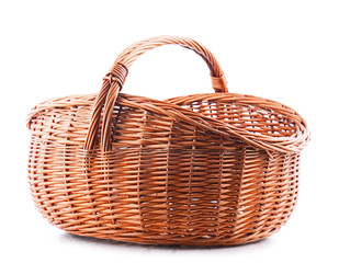 Empty wicker basket isolated on white