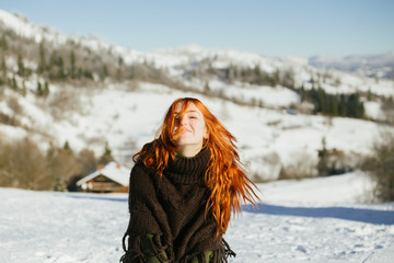 Fototapeta na wymiar red-haired girl in the mountains of the Tatras