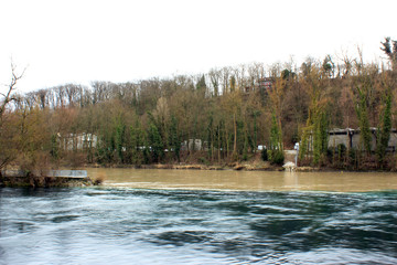 Rivers meet in the Geneva. Turquoise and brown flows 