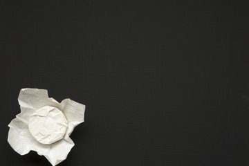 Cheese camembert or brie on dark background. Milk production. Top view. Flat lay. Copy space.