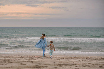 Mom and son on the beach.