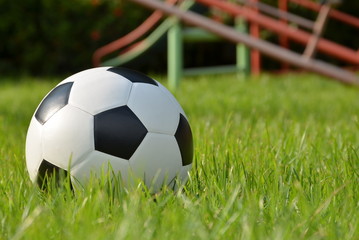 Football or soccer ball on the green grass,outdoor activity.