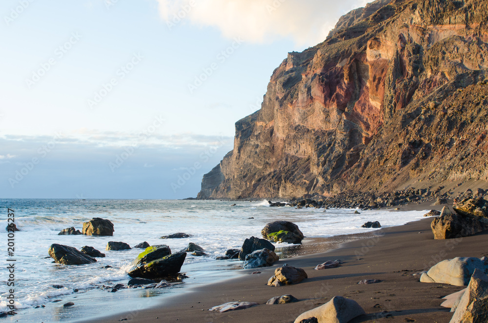 Wall mural black sand beach at the atlantic ocean in la gomera, one of the canary islands.