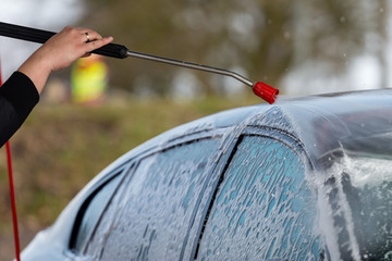 Car without touch washing self-service. Wash with water and foam.