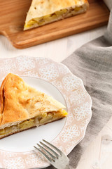 slice of homemade potato pie on pink plate