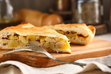 slices of homemade potato pie on cutting board