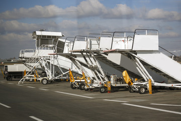 Ladders for the plane stand in a row at the airport