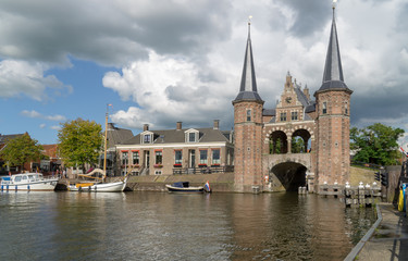 Fototapeta na wymiar Waterpoort (Water gate) seen from the Lemmerweg in the city of Sneek in the province Friesland, The Netherlands