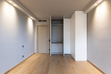 Front view of modern room with large wardrobe
