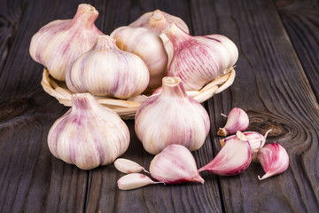 Cloves of garlic on wooden background