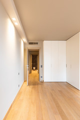 Front view of modern room with large wardrobe