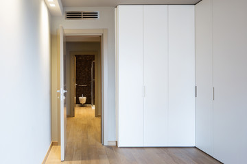 Front view of modern room with large wardrobe