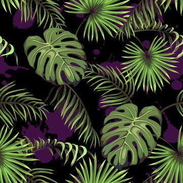 Dark seamless pattern with leaves of palm trees