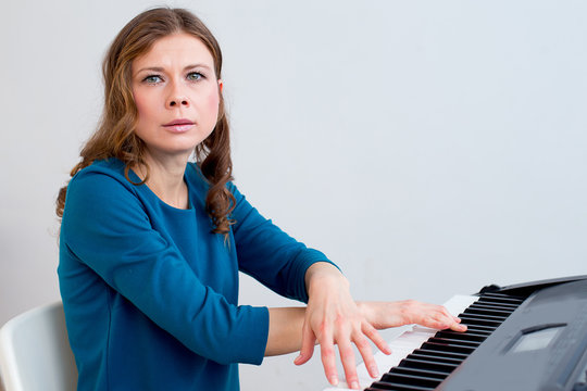 Woman playing synthesizer