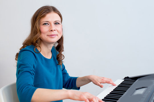 Woman playing synthesizer