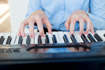 Girl playing synthesizer
