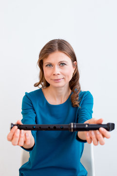 Woman playing on a flute